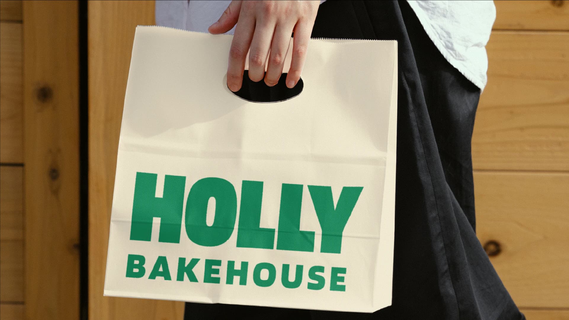 Sacola de papel com o logotipo Holly Bakehouse